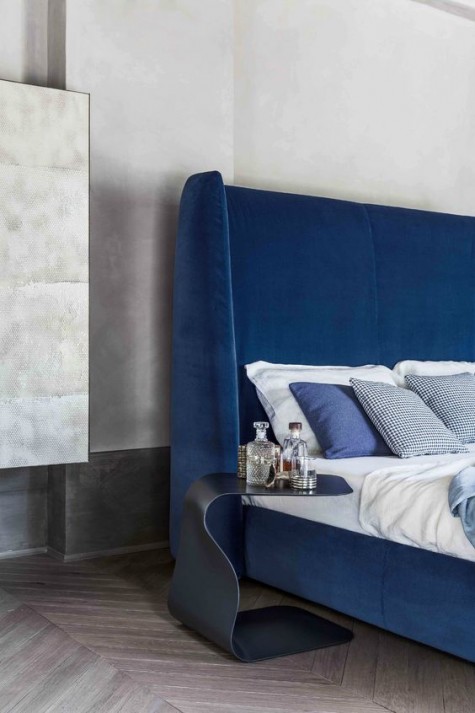 an ultra modern electric blue wingback headboard