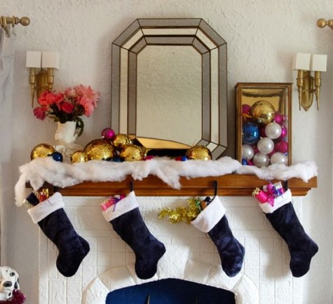 black stockings, colorful large ornaments and cotton snow