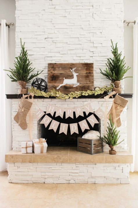 evergreen trees, a pallet deer sign, burlap stockings and a felt garland
