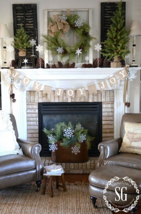 evergreens, pinecones, a burlap banner and lots of white snowflakes