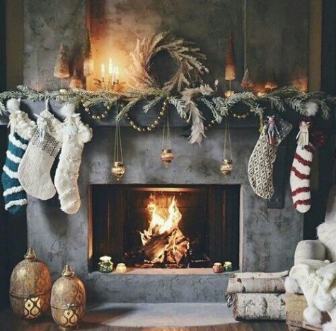 evergreens, stockings, lanterns, candles and beaded garland