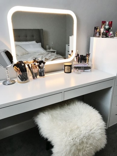 IKEA Micke desk as a vanity, a lit up mirror and some acrylic makeup storage
