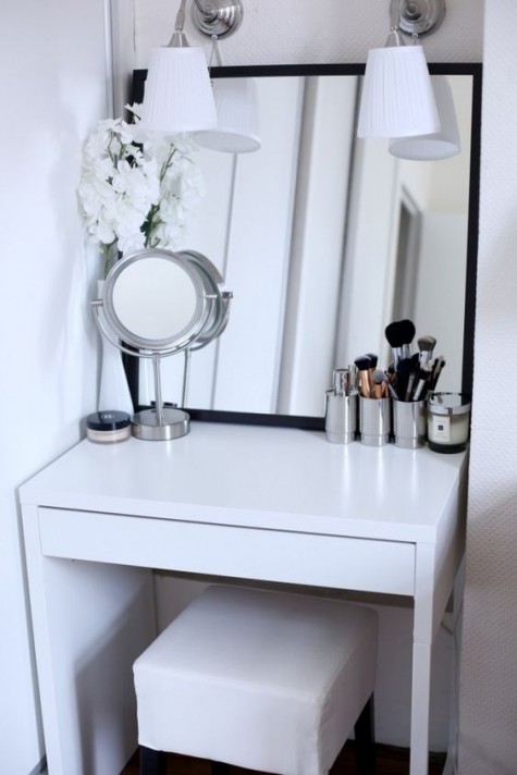 a Scandinavian space with IKEA Micke desk, lamps, a couple of mirrors