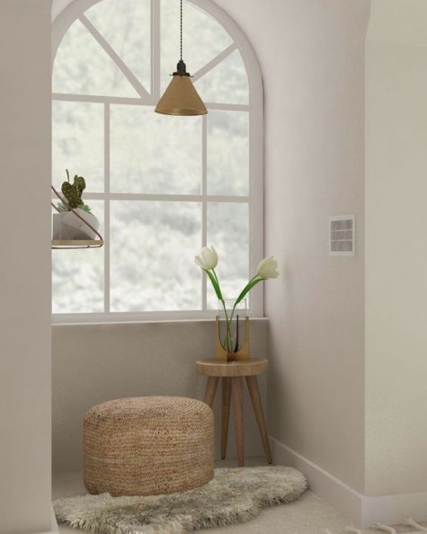 a comfy nook with an ottoman and a side table