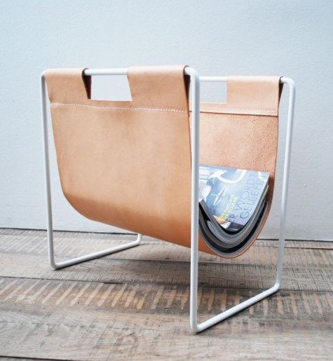 a leather magazine holder on metal piping