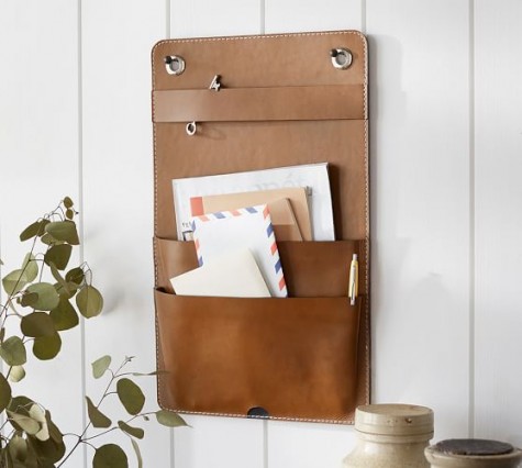 a leather pocket for storage is a great idea