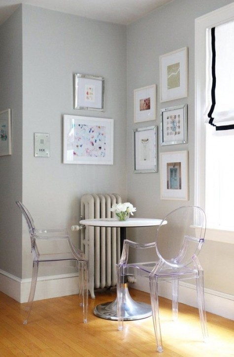 a simple breakfast space with Ghost chairs and a small round table