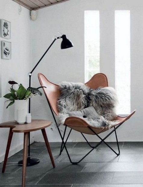 a stylish reading nook with a leather chair and a side table