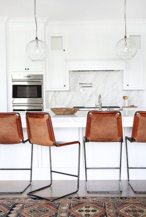 amber-colored leather stools for a breakfast bar