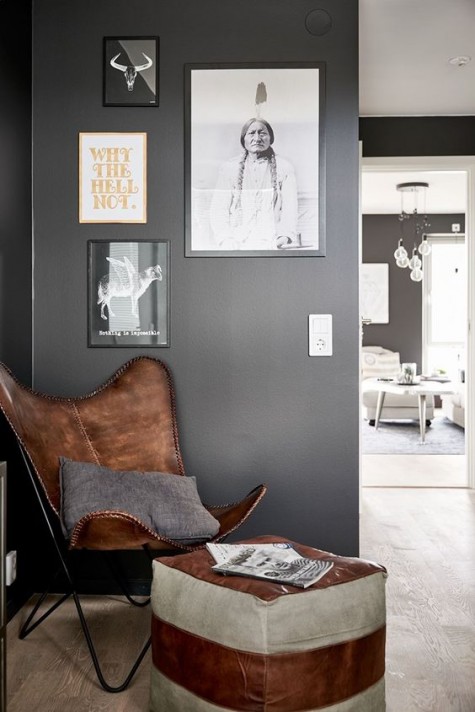 an eye-catchy brown leather chair with a striped leather ottoman