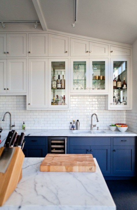 bold blue and white cabinets plus a white subway tile backsplash for a cool look with a touch of retro