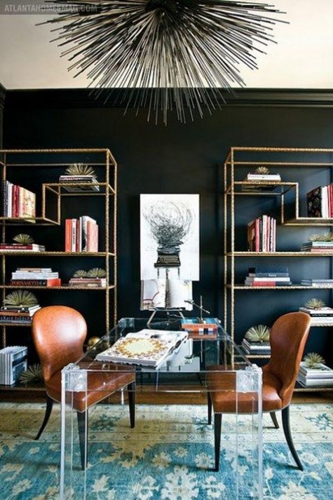 brown leather chairs and an acrylic desk