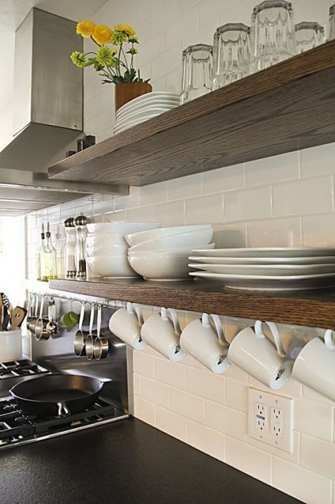 floating shelves in the kitchen with a mug hanger attached
