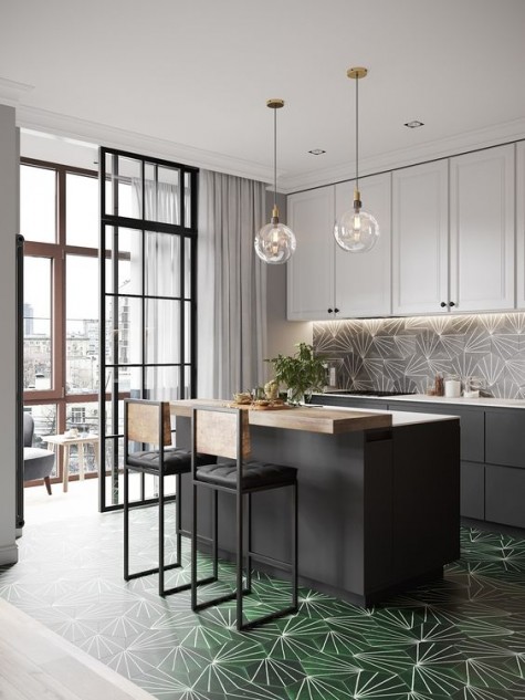 graphite grey and white cabinets are spruced up with geometric mid-century tiles on the backsplash and floor