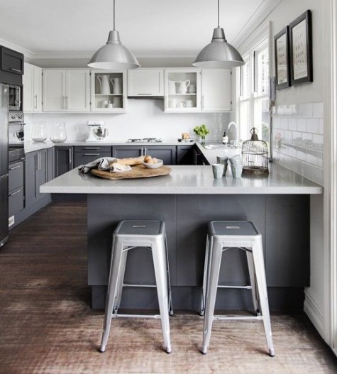 graphite grey cabinets, upper white ones plus granite countertops and metal stools for an industrial feel