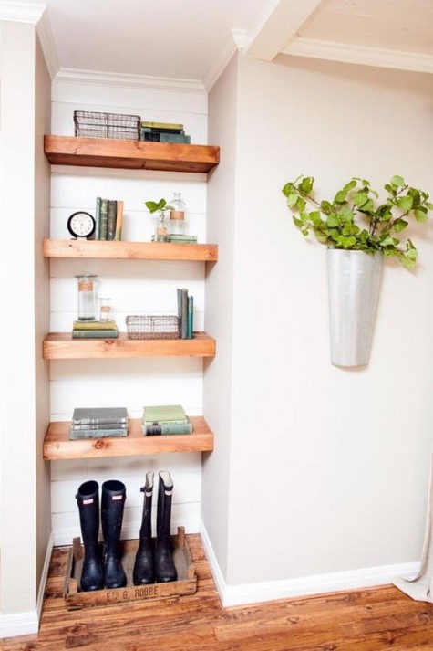 open shelving and boots storage under it for an entryway
