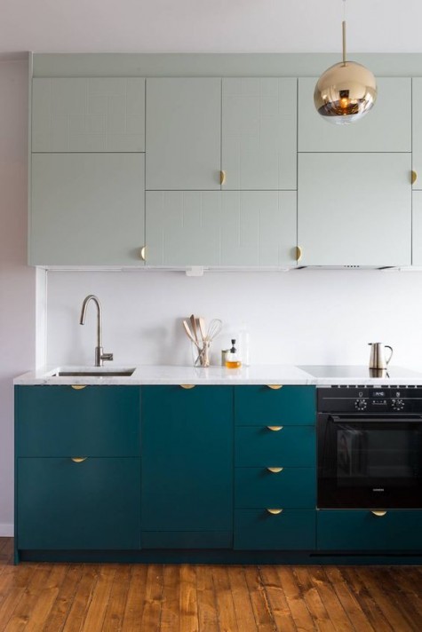 turquoise and light green cabinets with pulls for a modenr kitchen look