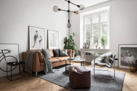 an airy and light-filled Nordic space with a tan leather Stockholm