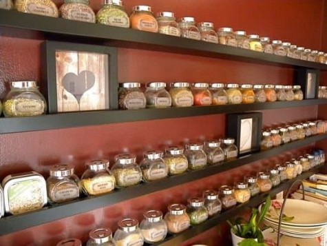 spices in jars placed on black IKEA Ribba ledges