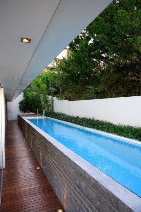 a long narrow pool raised up the deck for comfortable using