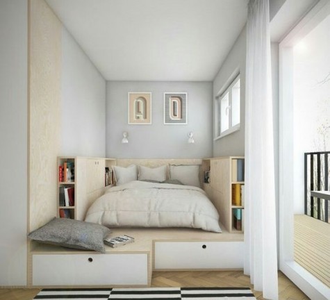 a podium with much storage space and a bed placed in it