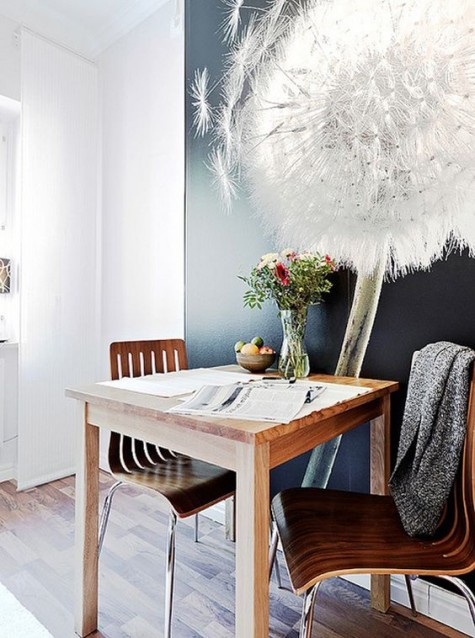 a small dining space with an oversized photograph that creates a mood
