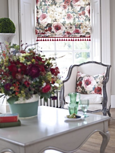 floral Roman shades and a small pillow for a refreshing summer look