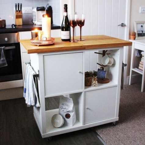 IKEA Kallax turned into a mobile kitchen island with a wooden countertop and some closed compartments