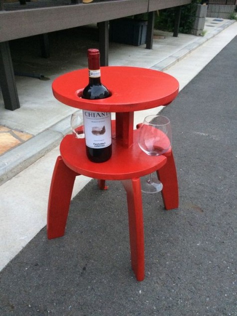 a Frosta wine table hack with holes to hold the bottle and glasses