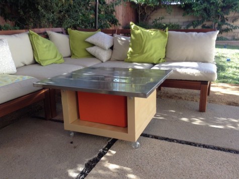 a durable outdoor table on casters made using Drona storage box, Ekby Mossby stainless steel shelves, LACK table