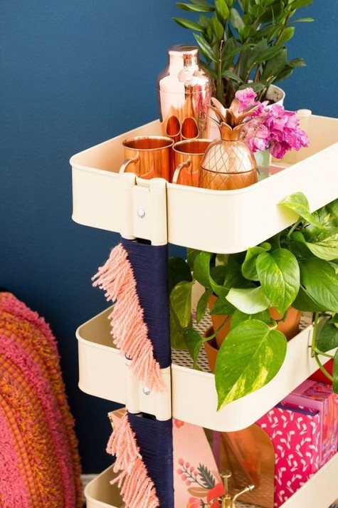 a simple IKEA Raskog hack with colorful yarn for a boho feel