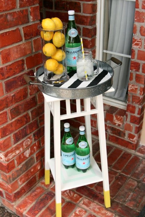 a small bar cart made of an IKEA plant stand and a metal tray for a tiny space