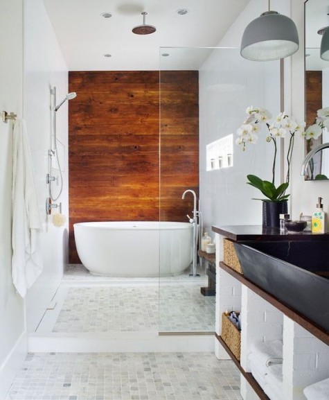 a wood statement wall to highlight the bathtub and make your bathroom cooler