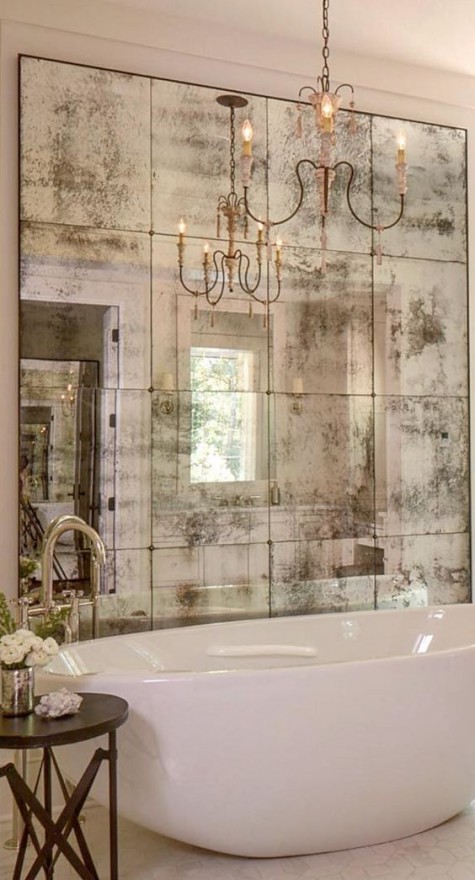 an antique mirror statement wall will make the space very refined