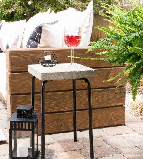 an industrial side table of concrete and IKEA Marious stool