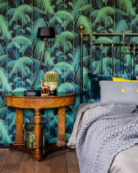 moody printed tropical leaf wallpaper for a slight vintage feel in the space
