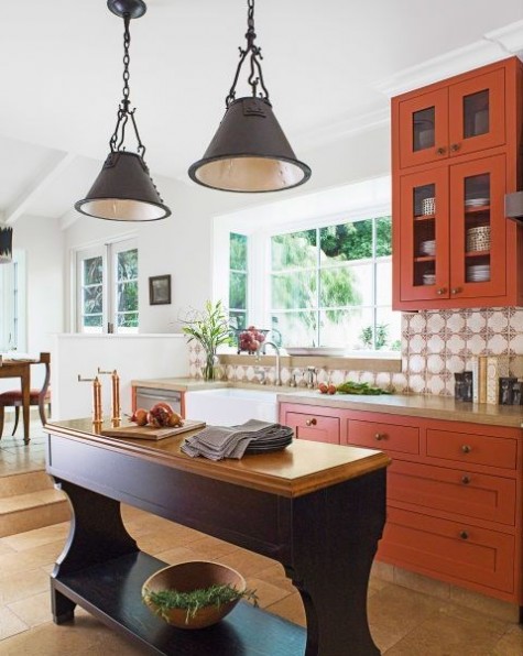 a bold fall kitchen in rust color with a rustic aubergine kitchen island