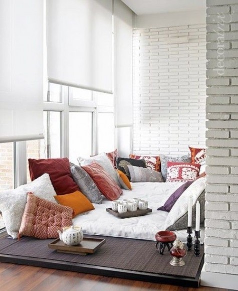 a neutral boho lounge spruced up with colorful printed pillows