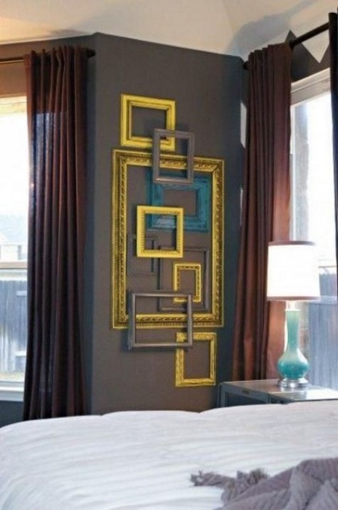 adding a sophisitcated touch to your bedroom is easy with some gilded and grey empty frames