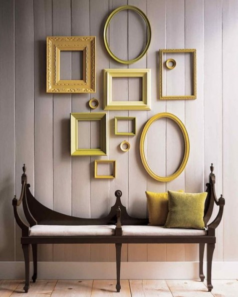 an elegant entryway with a catchy bench and frames in the shades of yellow