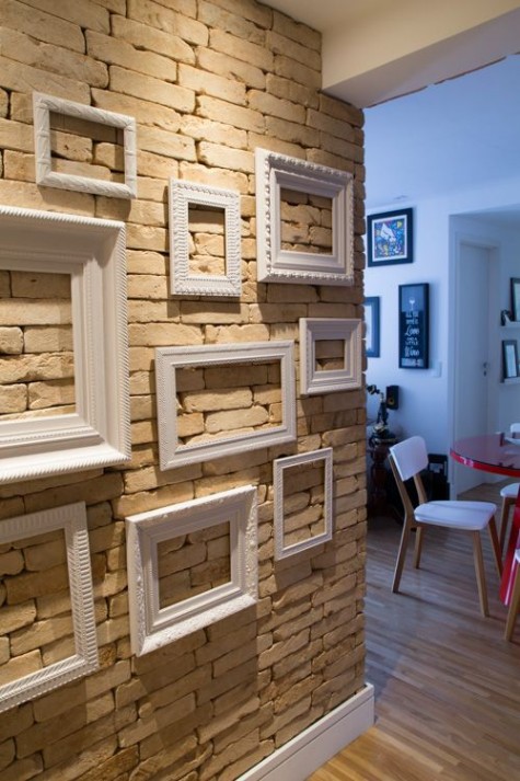 hang some vintage frames in your entryway to soften the industrial feel of the space
