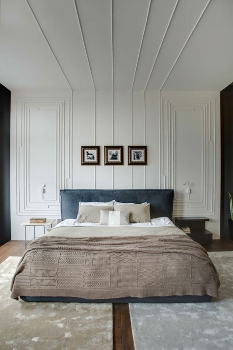molding on the wall and ceiling make the bedroom sophisticated and very eye-catching