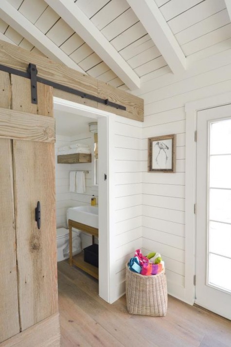 white painted wood and light-colored wood create a chic rustic space