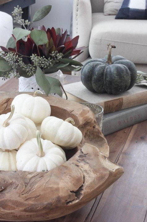 white pumpkins in a raw wood bowl
