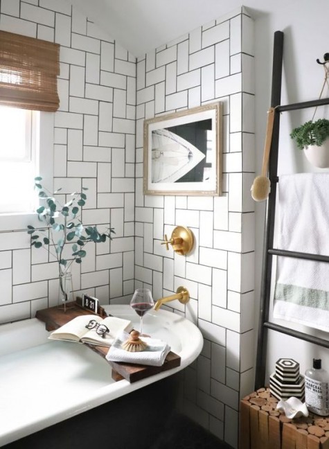 white tiles clad in an eye-catchy way and highlighted with black grout