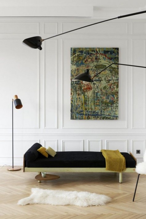 white walls with molding, which brings a chic and refined feel to the space