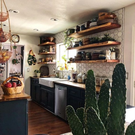 wooden shelves and wicker baskets plus potted cacti and greenery